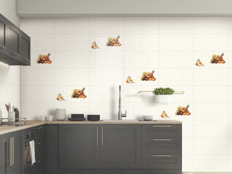 Fruit-themed kitchen backsplash design enhances dark cabinetry and a modern sink area with a stylish appeal.